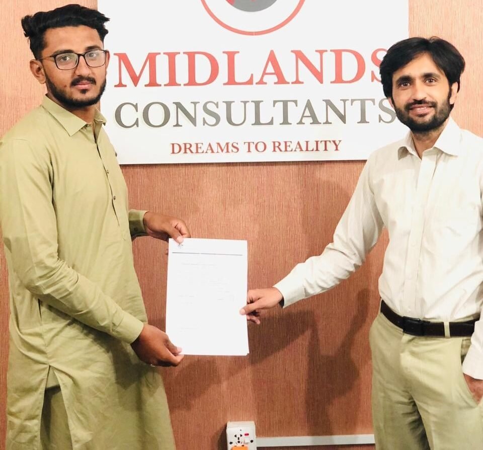 Mr. Usama Mukhtar receiving Australia study visa grant from our Director - Study in Australia from Pakistan
