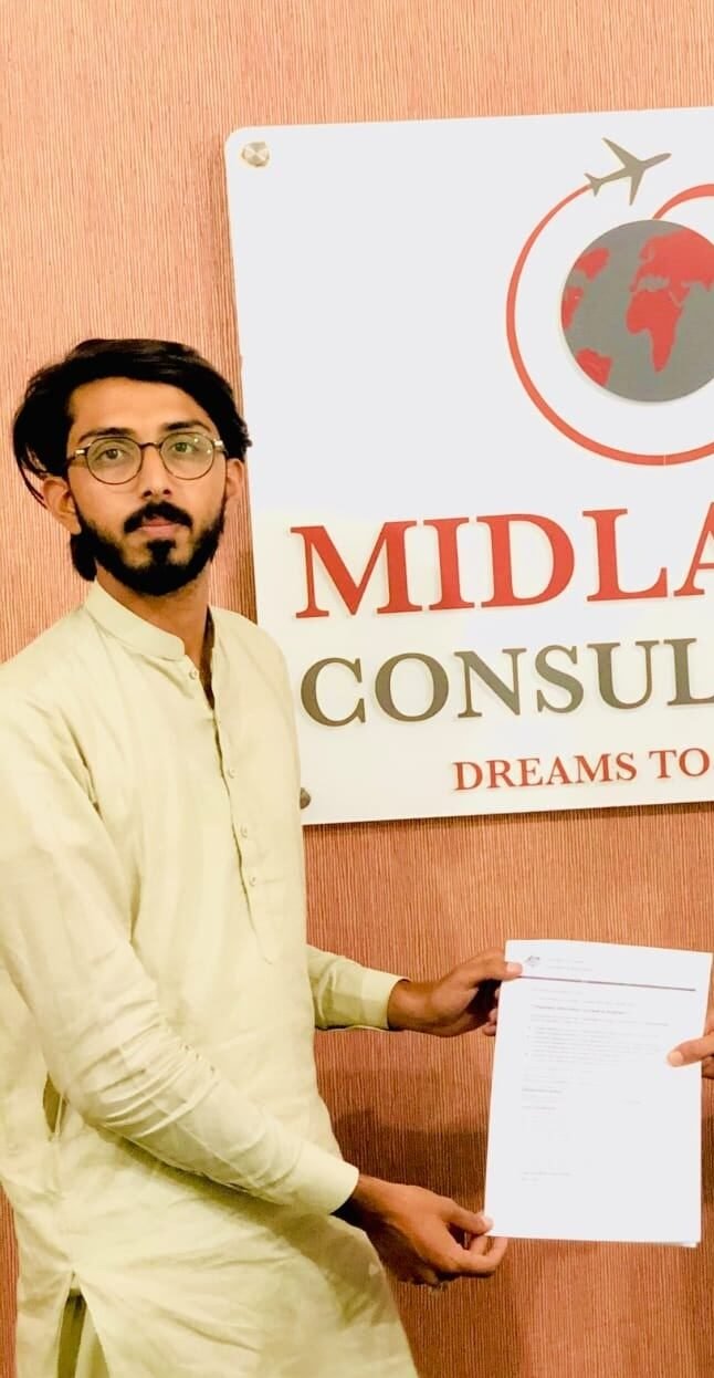 Mr. Hassan Ayub receiving Australia study visa grant from our Director - Study in Australia from Pakistan