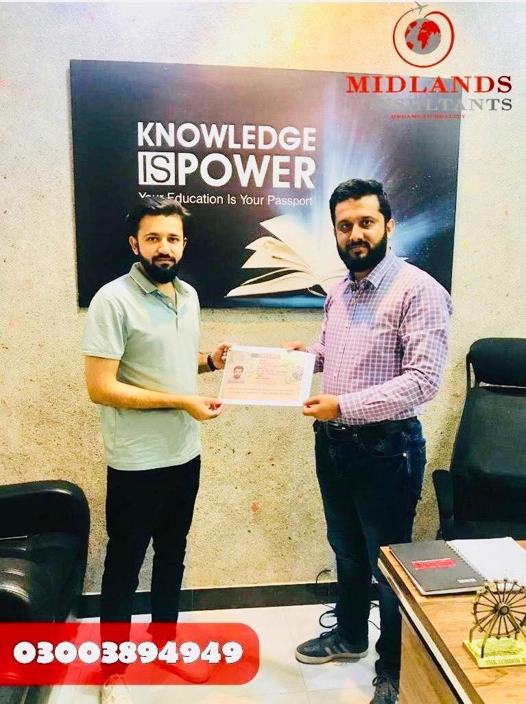 Student celebrating visa approval at Midlands Consultants
